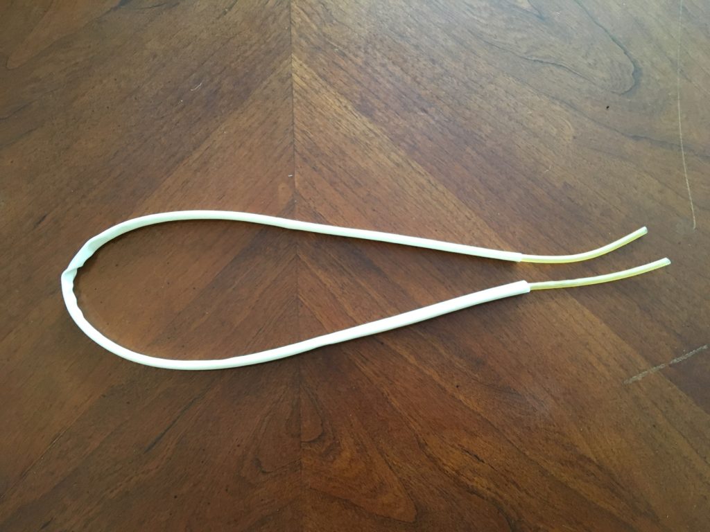 Latex tubing placed inside Penrose drain for vasectomy scrotal model