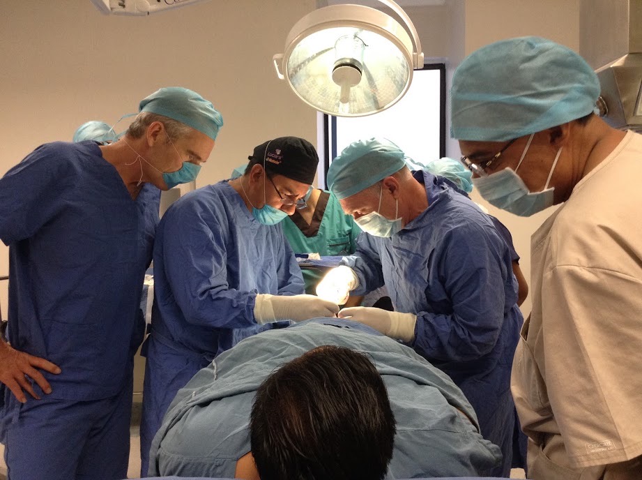 Michel Labrecque doing vasectomy in Mexico with John Curington over shoulder
