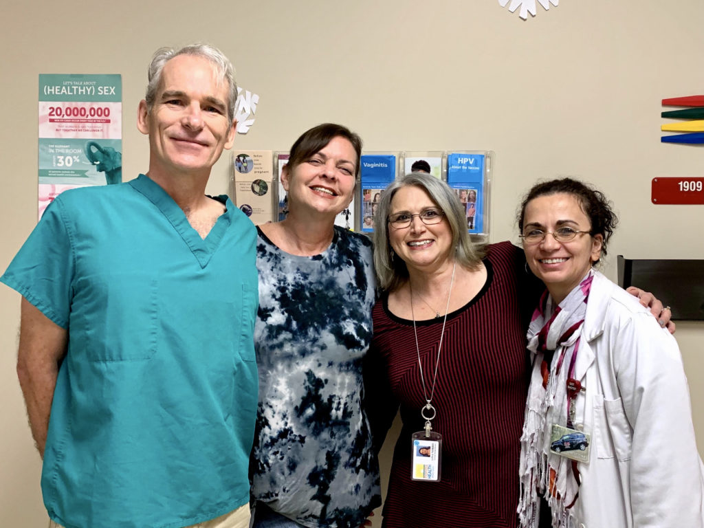 Dr. John Curington with Kristin Gina Radostina in the Pinellas County Public Health Clinic